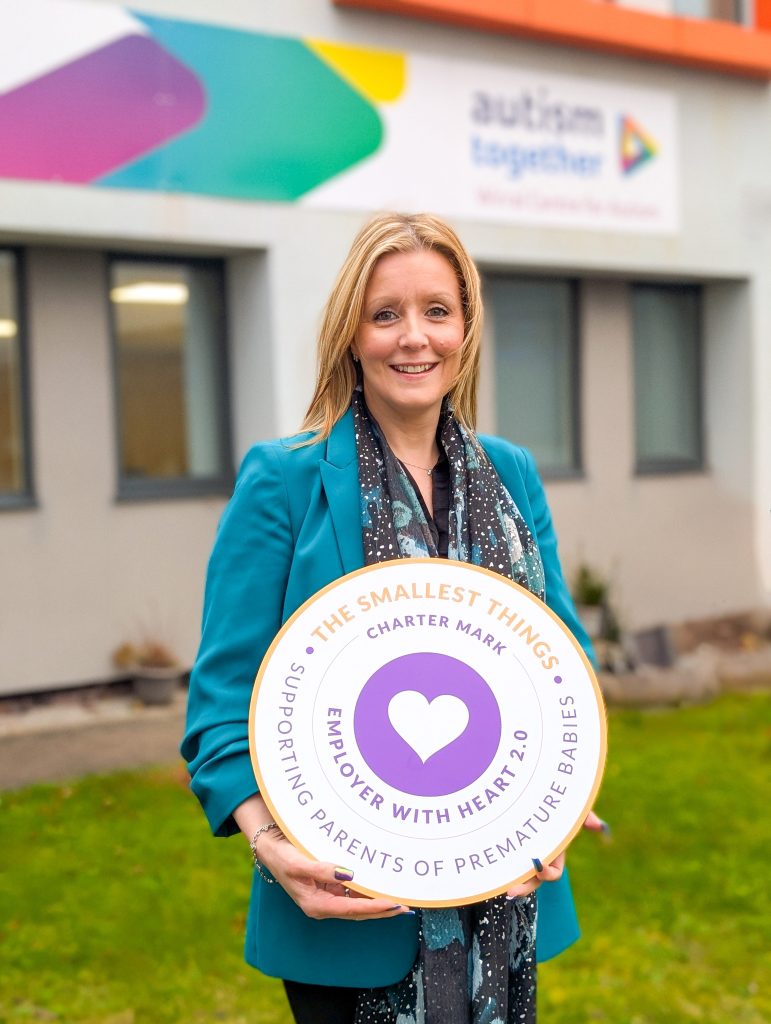 Helen Bilton, Autism Together’s Director of People and Culture, holding The Smallest Things charter mark, received after the Wirral-based charity were recognised for supporting families of premature babies, in the workplace